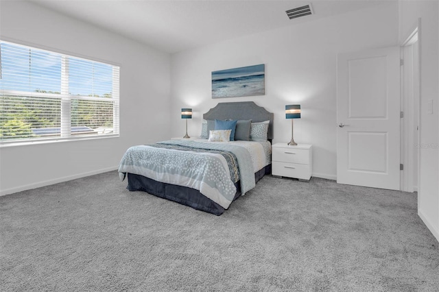 carpeted bedroom with baseboards