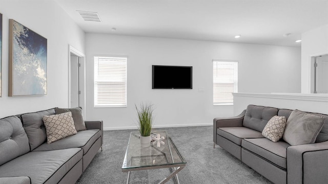 living room with carpet floors, recessed lighting, and baseboards