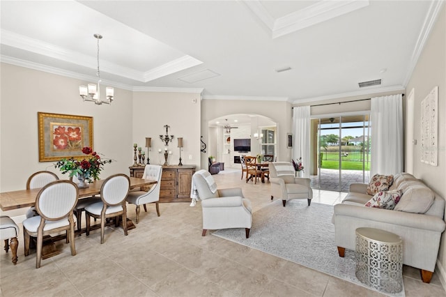 31754 Red Tail Blvd, Sorrento, FL 32776 - living room with arched walkways, a chandelier, ornamental molding, light tile patterned floors, and a raised ceiling