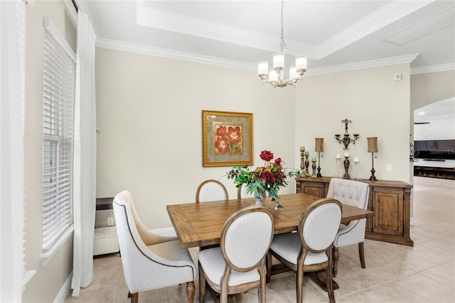 31754 Red Tail Blvd, Sorrento, FL 32776 - dining space with light tile patterned floors, ornamental molding, a chandelier, plenty of natural light, and a tray ceiling