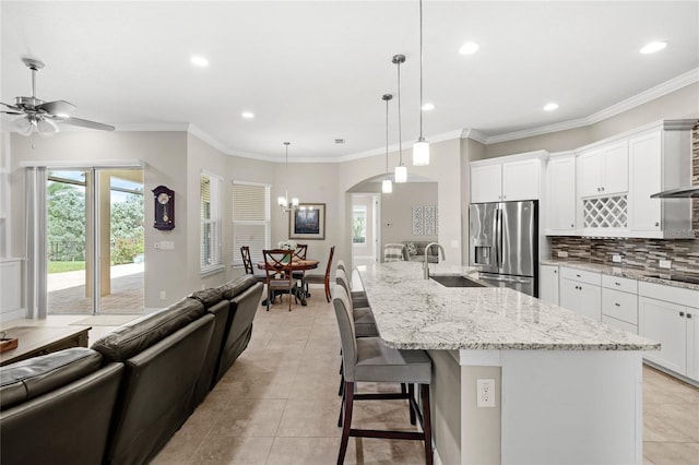 31754 Red Tail Blvd, Sorrento, FL 32776 - kitchen featuring stainless steel refrigerator with ice dispenser, a sink, tasteful backsplash, light tile patterned flooring, and recessed lighting