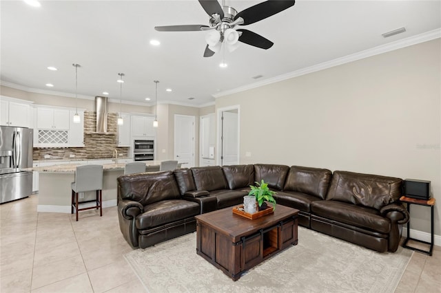 31754 Red Tail Blvd, Sorrento, FL 32776 - living room featuring light tile patterned flooring, ceiling fan, recessed lighting, crown molding, and baseboards