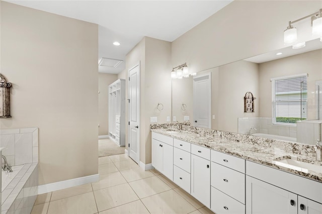 31754 Red Tail Blvd, Sorrento, FL 32776 - bathroom with double vanity, a garden tub, baseboards, tile patterned floors, and recessed lighting