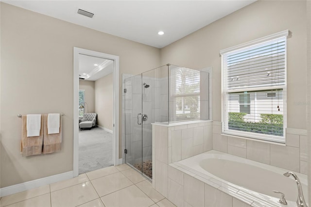 31754 Red Tail Blvd, Sorrento, FL 32776 - full bath featuring healthy amount of natural light, a shower stall, a bath, tile patterned floors, and recessed lighting