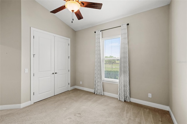 31754 Red Tail Blvd, Sorrento, FL 32776 - unfurnished bedroom featuring carpet floors, vaulted ceiling, a closet, baseboards, and ceiling fan