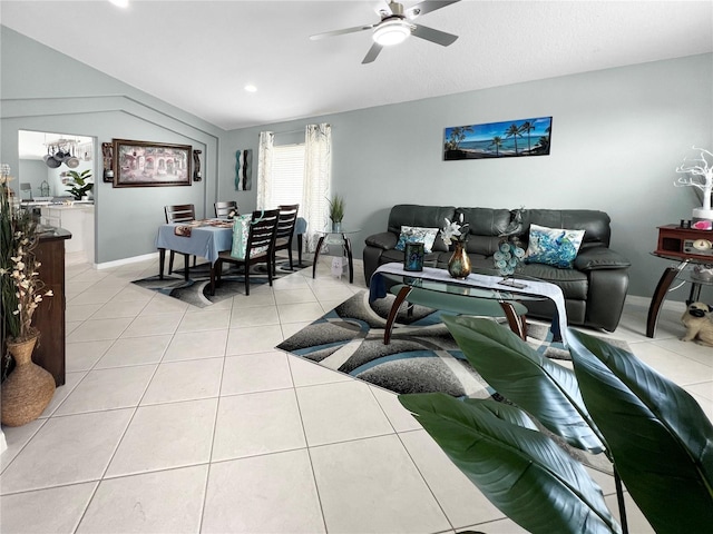 living room with ceiling fan, light tile patterned floors, and baseboards