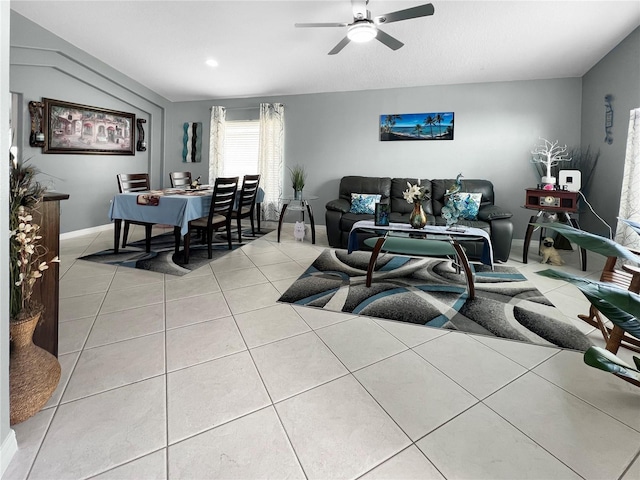 living room with a ceiling fan and light tile patterned floors