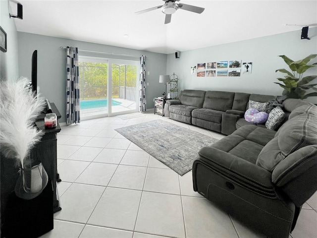 living area featuring a ceiling fan and light tile patterned floors
