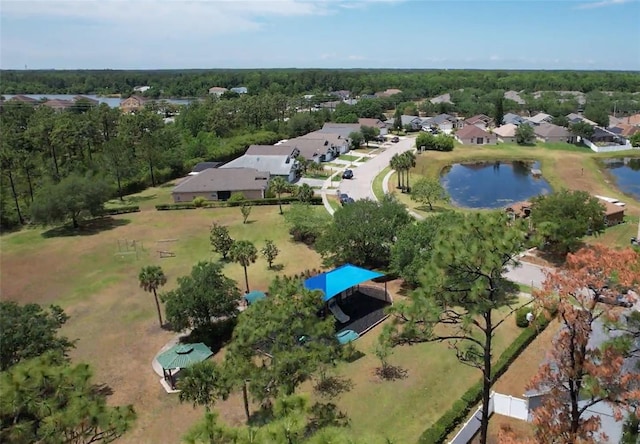 aerial overview of property's location featuring a nearby body of water and nearby suburban area