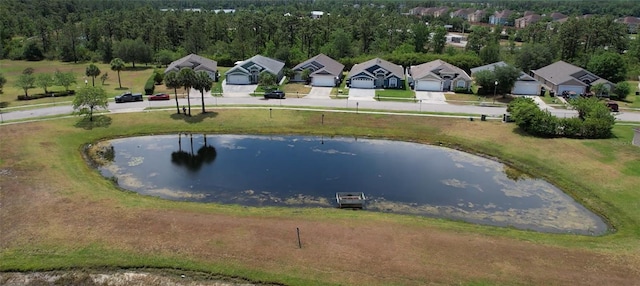 aerial perspective of suburban area featuring a nearby body of water