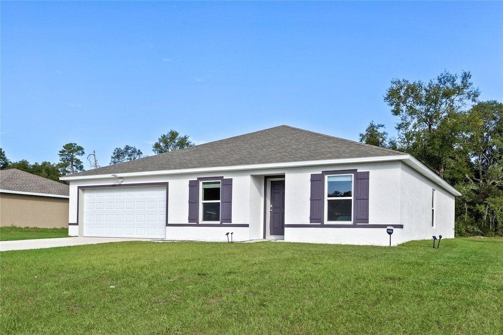 2701 SW 153rd Ln, Ocala, FL 34473 - ranch-style house with a garage, a front lawn, concrete driveway, a shingled roof, and stucco siding