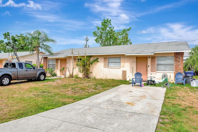 6520/6522 12th St W, Bradenton, FL 34207 - view of front of property with a front yard and stucco siding