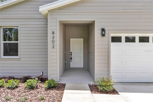 8202 SW 123rd Ter, Dunnellon, FL 34432 - doorway to property featuring a garage