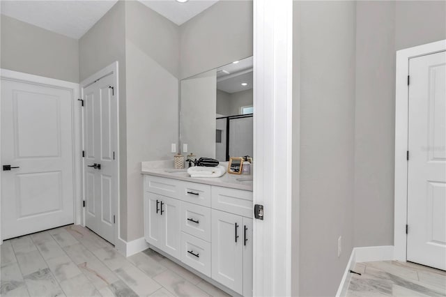 8202 SW 123rd Ter, Dunnellon, FL 34432 - full bathroom featuring double vanity, baseboards, marble look tile flooring, and a shower with door