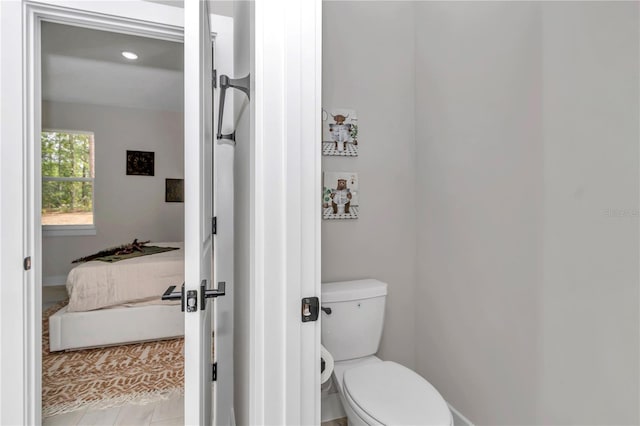 8202 SW 123rd Ter, Dunnellon, FL 34432 - bathroom featuring toilet, baseboards, and recessed lighting