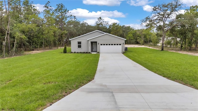 8202 SW 123rd Ter, Dunnellon, FL 34432 - view of front of home featuring a front yard, driveway, and a detached garage