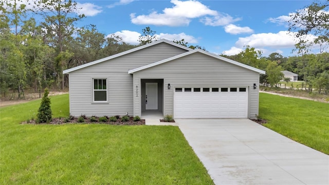 8202 SW 123rd Ter, Dunnellon, FL 34432 - view of front of home with a front yard, an attached garage, and driveway