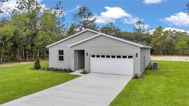 8202 SW 123rd Ter, Dunnellon, FL 34432 - view of front facade with central air condition unit, a front yard, concrete driveway, and an attached garage