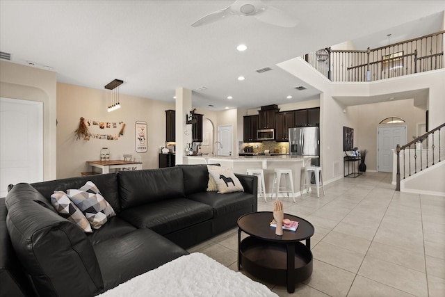 1501 Prairie Oaks Dr, Saint Cloud, FL 34771 - living room featuring ceiling fan, light tile patterned floors, stairs, baseboards, and recessed lighting
