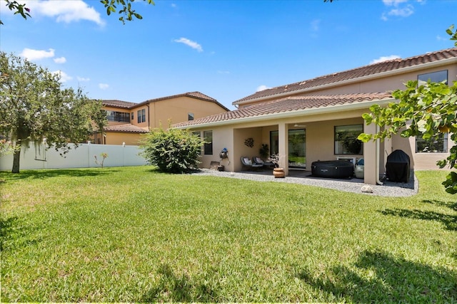 1501 Prairie Oaks Dr, Saint Cloud, FL 34771 - rear view of house featuring a jacuzzi, stucco siding, a tiled roof, and a patio