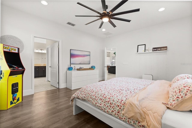 1501 Prairie Oaks Dr, Saint Cloud, FL 34771 - bedroom with wood finished floors, recessed lighting, baseboards, ensuite bath, and a ceiling fan