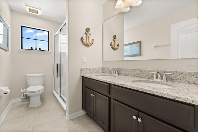 1501 Prairie Oaks Dr, Saint Cloud, FL 34771 - full bath featuring toilet, baseboards, a shower stall, tile patterned flooring, and double vanity