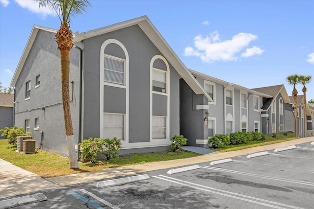 4160 Pershing Pointe Pl Unit 4, Orlando, FL 32822 - view of building exterior with uncovered parking