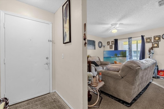 4160 Pershing Pointe Pl Unit 4, Orlando, FL 32822 - foyer with a textured ceiling, a ceiling fan, baseboards, and carpet floors