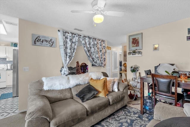 4160 Pershing Pointe Pl Unit 4, Orlando, FL 32822 - carpeted living area featuring ceiling fan and a textured ceiling