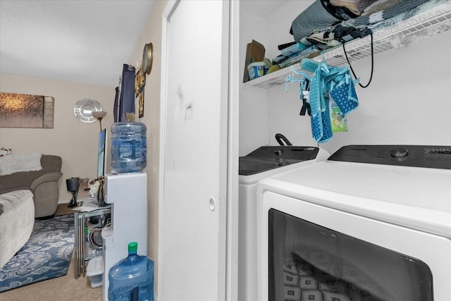 4160 Pershing Pointe Pl Unit 4, Orlando, FL 32822 - laundry room with washing machine and dryer and carpet floors