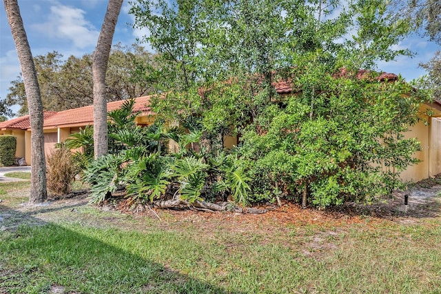 5039 Jamaica Cir Unit 10, Orlando, FL 32808 - view of front of home with stucco siding and a tiled roof
