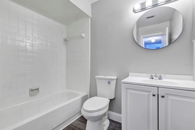 5039 Jamaica Cir Unit 10, Orlando, FL 32808 - full bathroom with toilet, wood finished floors, vanity, shower / bath combination, and baseboards