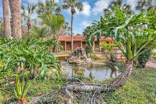 5039 Jamaica Cir Unit 10, Orlando, FL 32808 - view of community with a small pond