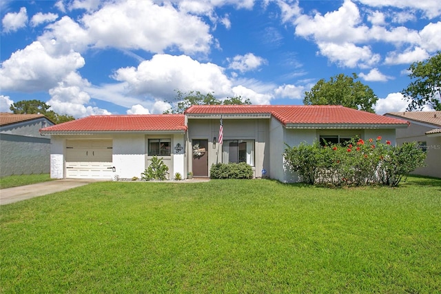 10148 Eventide Ct, Orlando, FL 32821 - view of front of home with a tile roof, stucco siding, an attached garage, and driveway