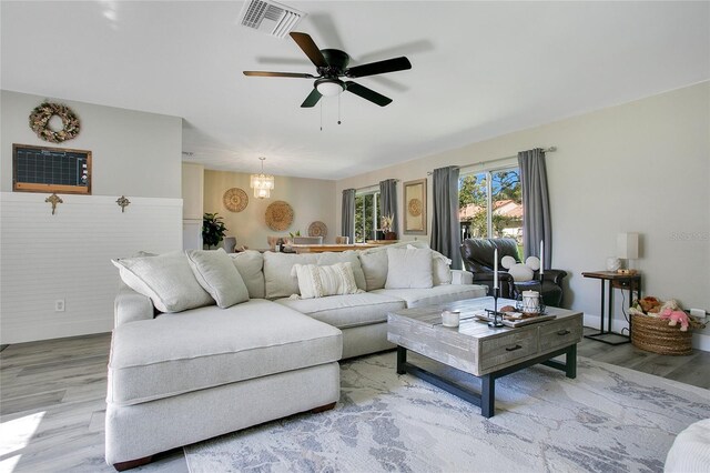 10148 Eventide Ct, Orlando, FL 32821 - living room featuring wood finished floors and a ceiling fan