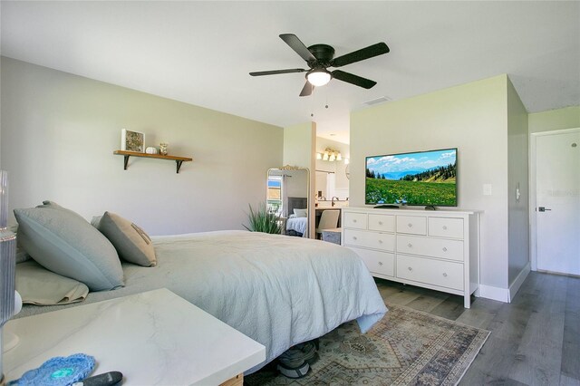 10148 Eventide Ct, Orlando, FL 32821 - bedroom with wood finished floors, a ceiling fan, and baseboards