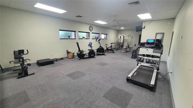 10148 Eventide Ct, Orlando, FL 32821 - workout area with a paneled ceiling, a ceiling fan, baseboards, and carpet flooring