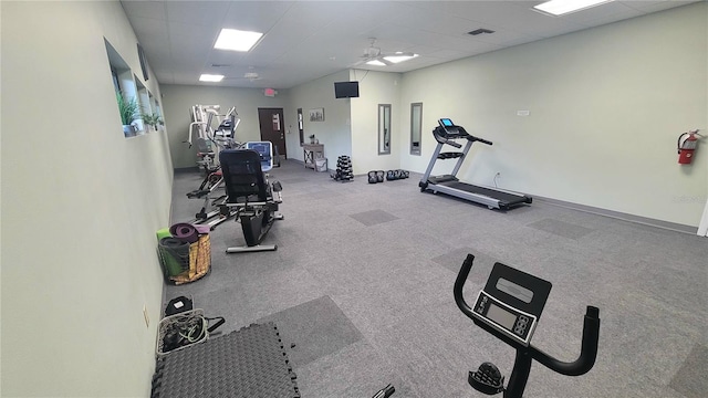 10148 Eventide Ct, Orlando, FL 32821 - exercise room featuring ceiling fan, a drop ceiling, baseboards, and carpet flooring