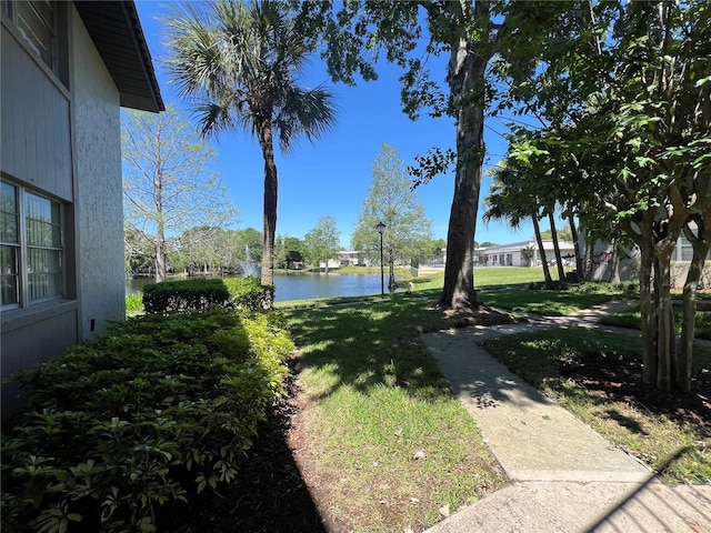 51 Windtree Ln Unit 101, Winter Garden, FL 34787 - view of green lawn featuring a water view