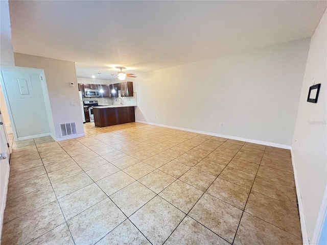 51 Windtree Ln Unit 101, Winter Garden, FL 34787 - unfurnished living room featuring light tile patterned floors, ceiling fan, and baseboards