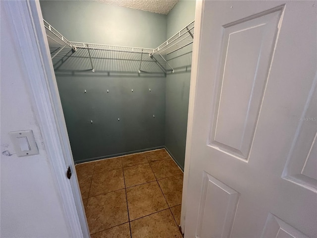 51 Windtree Ln Unit 101, Winter Garden, FL 34787 - spacious closet featuring tile patterned floors