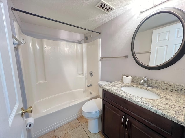 51 Windtree Ln Unit 101, Winter Garden, FL 34787 - bathroom with toilet, shower / washtub combination, tile patterned flooring, vanity, and a textured ceiling
