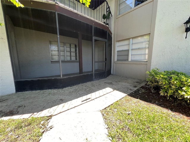 51 Windtree Ln Unit 101, Winter Garden, FL 34787 - doorway to property featuring stucco siding