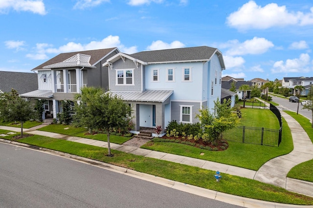 6875 Bridgman St, Orlando, FL 32827 - view of front of home featuring a standing seam roof, metal roof, a residential view, and stucco siding