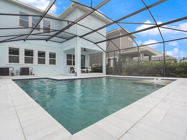 6875 Bridgman St, Orlando, FL 32827 - outdoor pool featuring central air condition unit, a patio, a ceiling fan, and a lanai