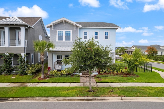 6875 Bridgman St, Orlando, FL 32827 - view of front of house with stucco siding, a standing seam roof, metal roof, and a residential view