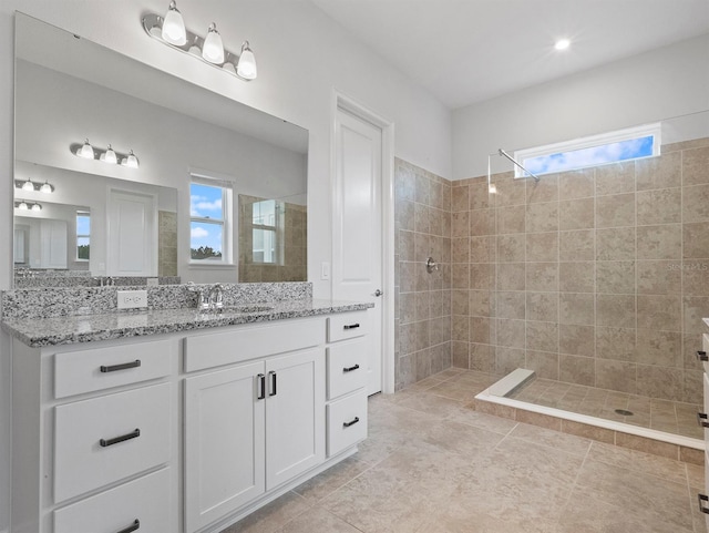 6875 Bridgman St, Orlando, FL 32827 - full bathroom featuring a tile shower, healthy amount of natural light, vanity, and tile patterned flooring