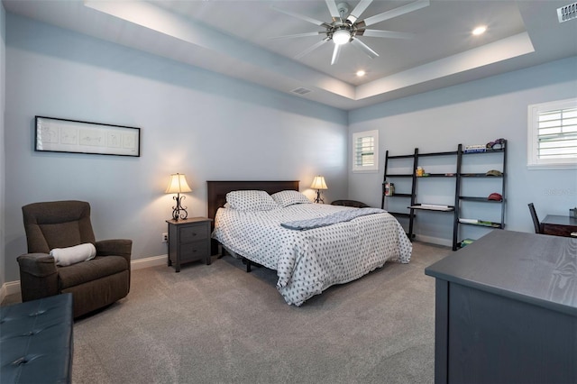 1212 Civitas Way, Winter Garden, FL 34787 - carpeted bedroom with a tray ceiling, recessed lighting, multiple windows, and baseboards
