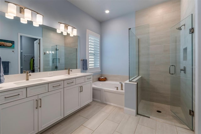 1212 Civitas Way, Winter Garden, FL 34787 - bathroom featuring a shower stall, double vanity, a bath, tile patterned flooring, and recessed lighting