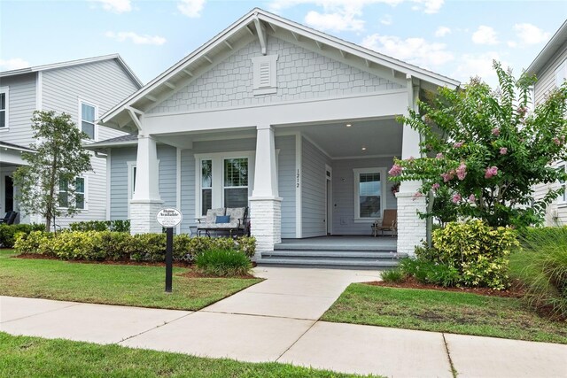 1212 Civitas Way, Winter Garden, FL 34787 - craftsman inspired home featuring covered porch and a front lawn